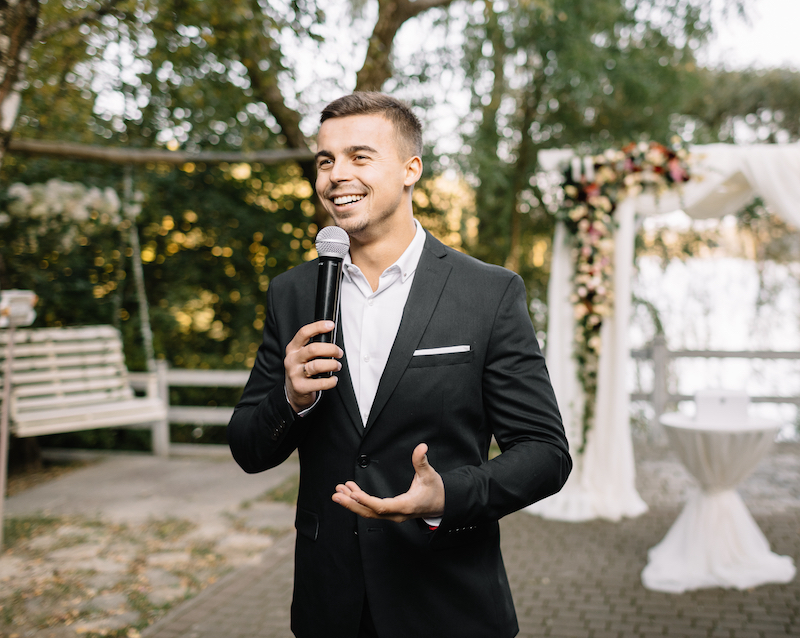 A wedding MC plays a crucial part in orchestrating the event and ensuring it runs smoothly